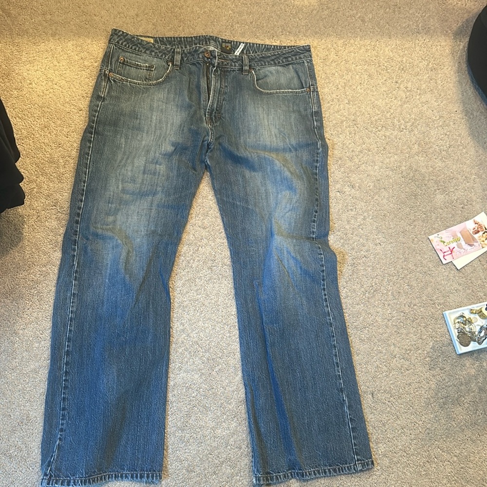 Dark blue washed bootcut jean, never worn